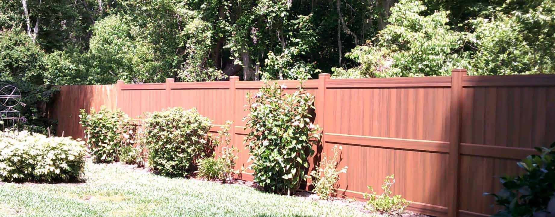 Sunny vinyl fence in backyard