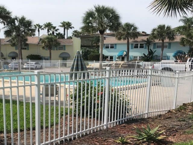 A New Fence Keeps Your Pool Safe and Sparkling Clean this Summer