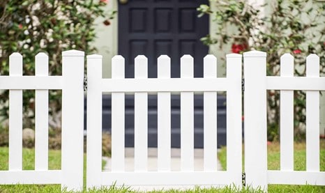 Matching your fence to your home's exterior white vinyl fence