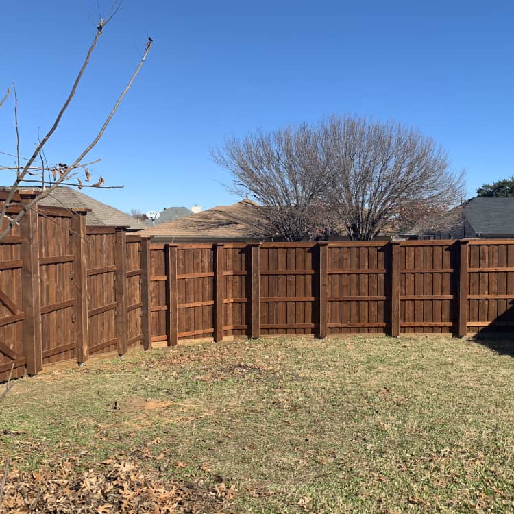 Rosenberg fence company dark stained wood fence