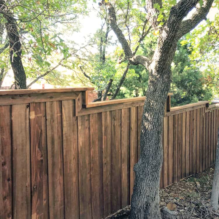 Rosharon fence company dark stained wood fence