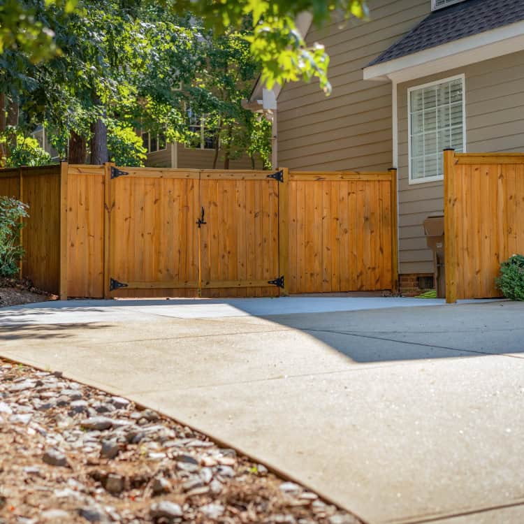 Newport fence company stained wood fence with gate